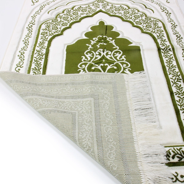 white and green muslim prayer rug